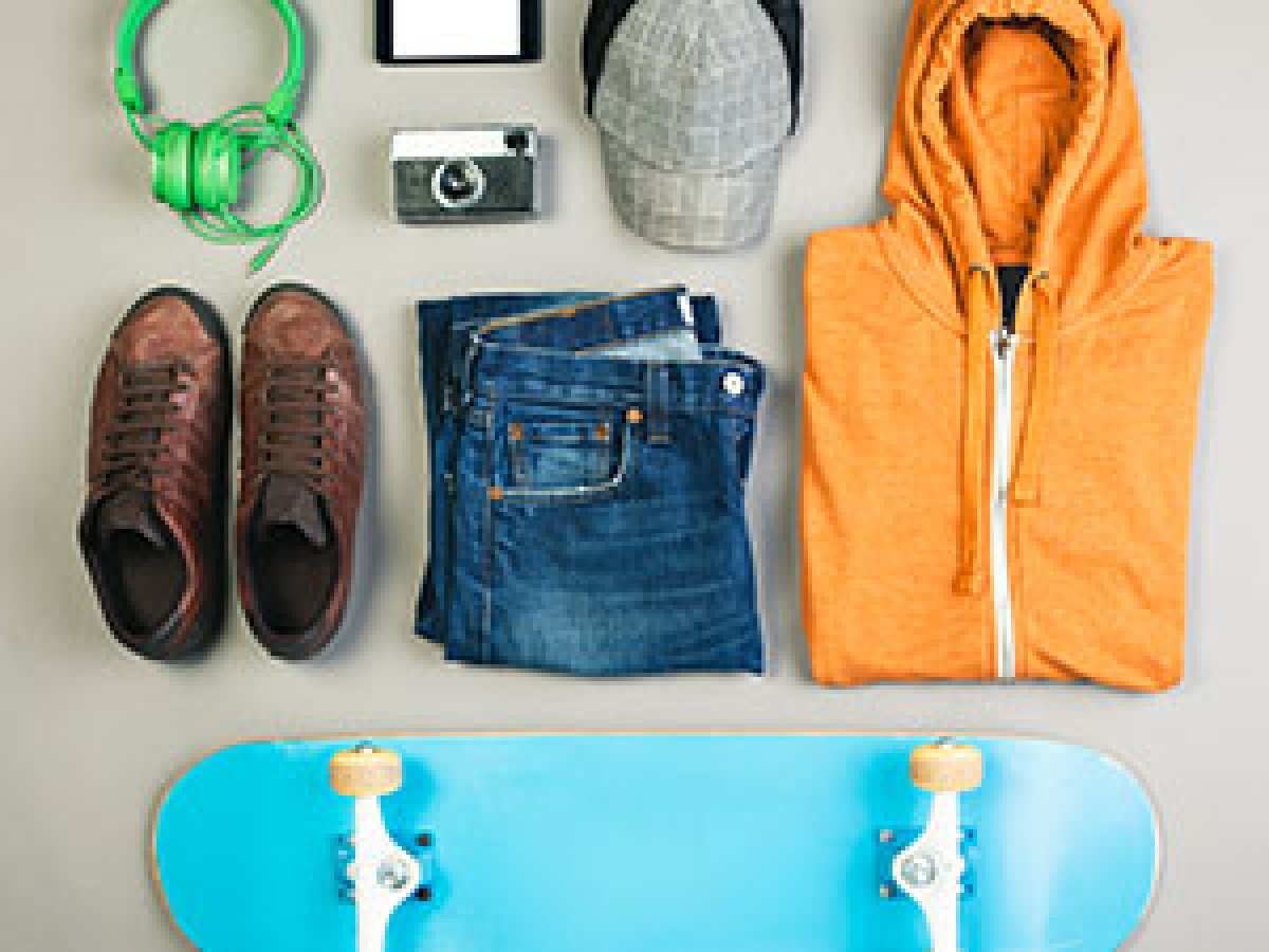 Skateboard, shoes, hat and photo camera